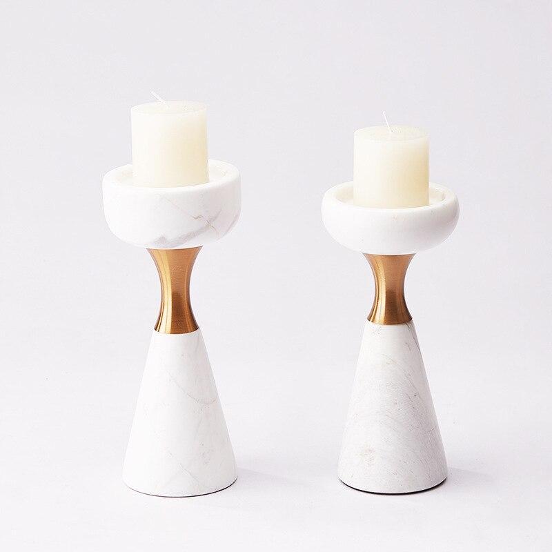Pair of Elegant Marble Candle Holders with white candles, combining simplicity and style for upscale home accents.