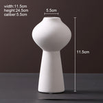 Scandinavian ceramic vase with a minimalist design, perfect for modern home decor and displaying fresh or dried flowers.