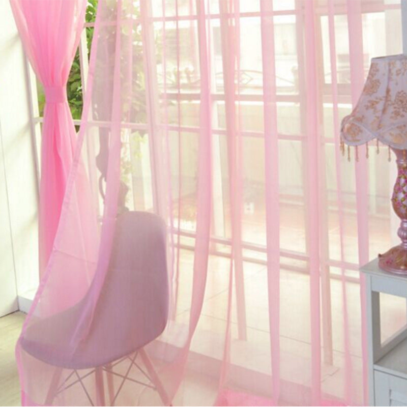 Modern tulle sheer curtains hanging in a bright living room and bedroom, allowing natural light to filter through softly