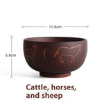 Ethnic wooden bowl with intricate carved patterns, showcasing traditional craftsmanship and rustic decorative style