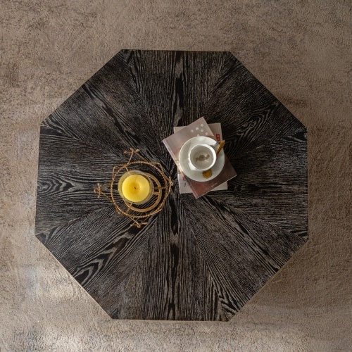 Top view of Retro Octagon Coffee Table showing dark wood grain surface with decorative items, highlighting its compact and stylish design.