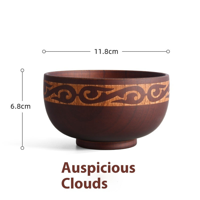 Ethnic wooden bowl with intricate carved patterns, showcasing traditional craftsmanship and rustic decorative style