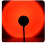 Red glow from Sunset Projection Lamp - Adjustable Decor, casting a bold circular light for dramatic night lighting ambiance.