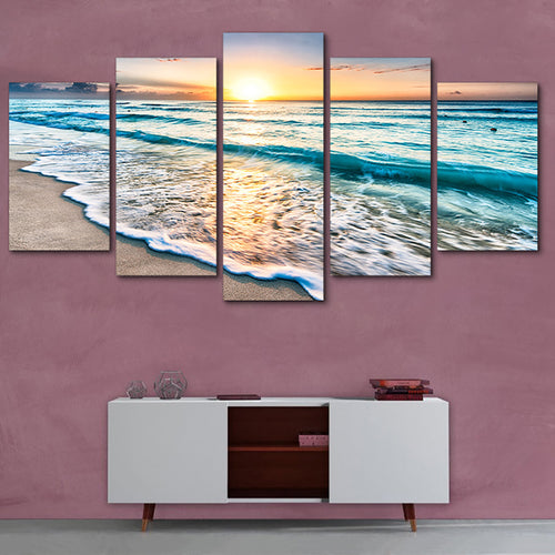 5 panel ocean wall art featuring sunset beach waves on a pink wall above a modern white console. Canvas print, no frame, easy to hang.