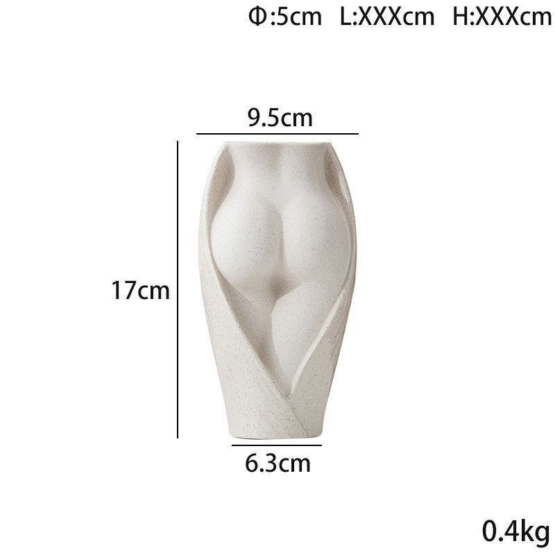 Small modern ceramic vase with sculpted female form, measuring 17cm tall and 0.4kg, ideal for compact floral displays or shelf decor.