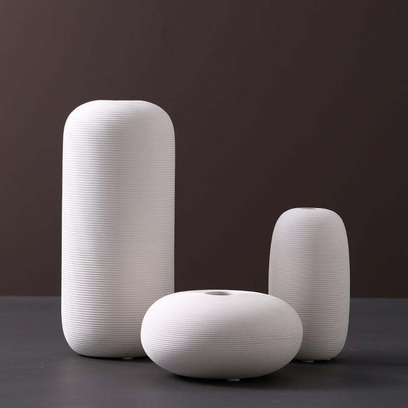Scandinavian ceramic vase with a minimalist design, perfect for modern home decor and displaying fresh or dried flowers.
