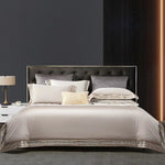Elegant 4-piece embroidered bedding set with 140 thread count, displayed on a neatly made bed for a luxurious bedroom look