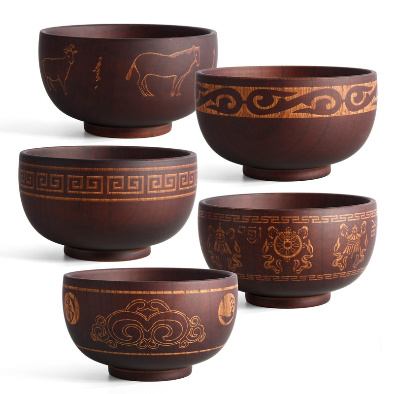 Ethnic wooden bowl with intricate carved patterns, showcasing traditional craftsmanship and rustic decorative style