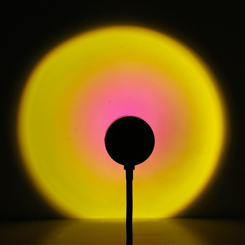 Pink and yellow gradient from Sunset Projection Lamp - Adjustable Decor, creating a soft and colorful wall lighting effect.