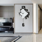 Personalized wall clock in black with bold numbers and quartz design, enhancing a contemporary living room wall. Stylish 15-inch decor piece.