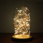 Glow Mode Atmosphere LED Night Lamp featuring warm string lights inside a glass dome with wooden base. Enhances nighttime relaxation.