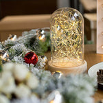 Wooden base Atmosphere LED Night Lamp with glass cover, surrounded by festive decor. Perfect for holiday ambiance and mood lighting.