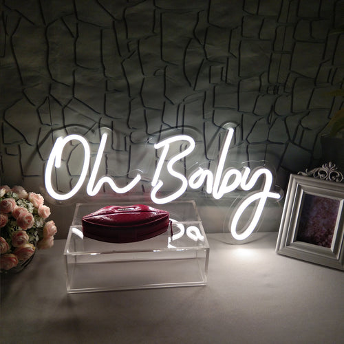 Oh Baby LED Neon Sign - Birthday Light Decor in white script, perfect for baby showers or birthday party decorations on a textured wall background.