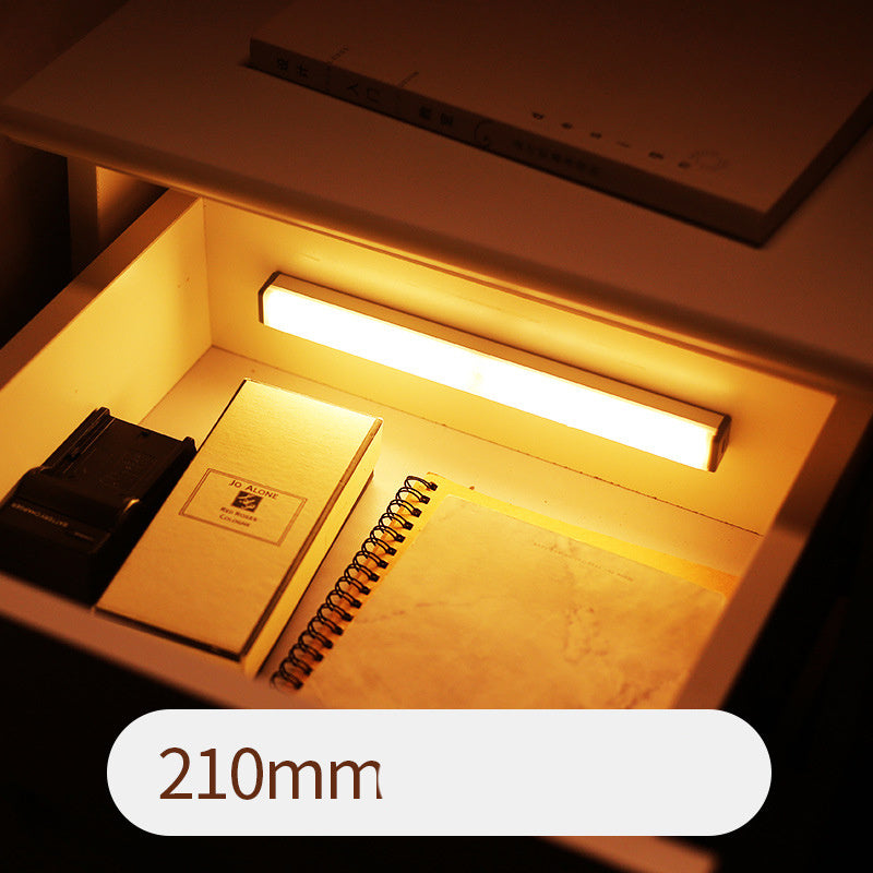 USB rechargeable LED sensor light bar mounted under a cabinet, emitting bright white light with a sleek modern designUSB rechargeable LED sensor light bar mounted under a cabinet, emitting bright white light with a sleek modern design