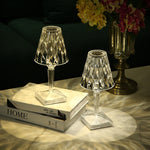Diamond Table Lamp Portable Wireless | LED, Touch shown in two sizes on a marble table, casting elegant light patterns in a bedroom setting.