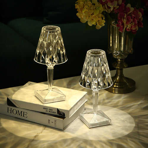 Diamond Table Lamp Portable Wireless | LED, Touch shown in two sizes on a marble table, casting elegant light patterns in a bedroom setting.